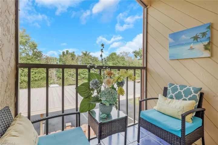 Balcony featuring a sunroom