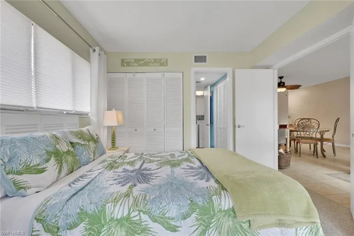 Bedroom featuring tile patterned floors and a closet