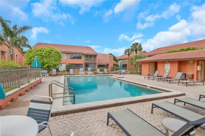 Community pool featuring a patio
