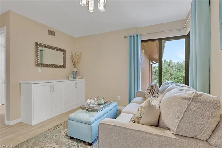 Living area featuring wood finished floors and baseboards
