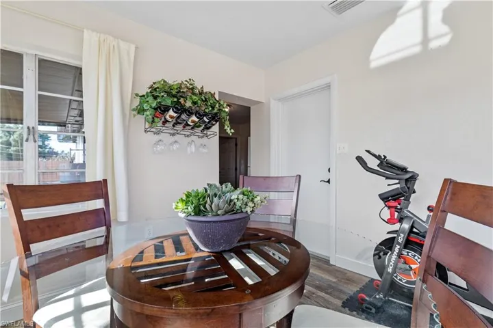 Exercise room featuring hardwood / wood-style flooring