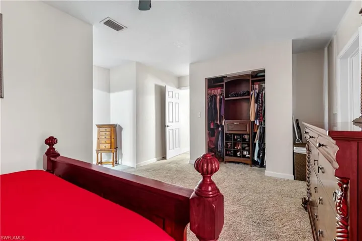 Bedroom with carpet floors and a closet