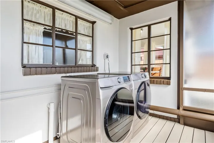 Laundry area featuring separate washer and dryer
