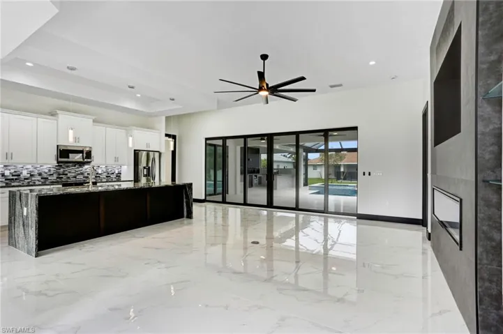 Built-in electric fireplace, and recessed space for large screen TV
