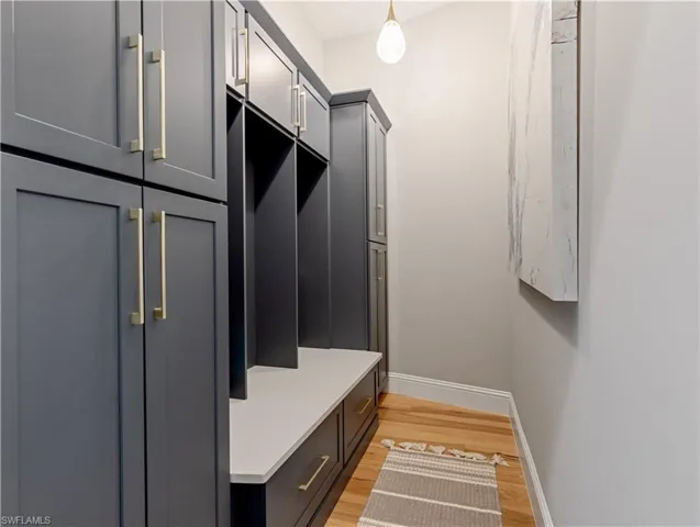 Mudroom with light hardwood / wood-style floors