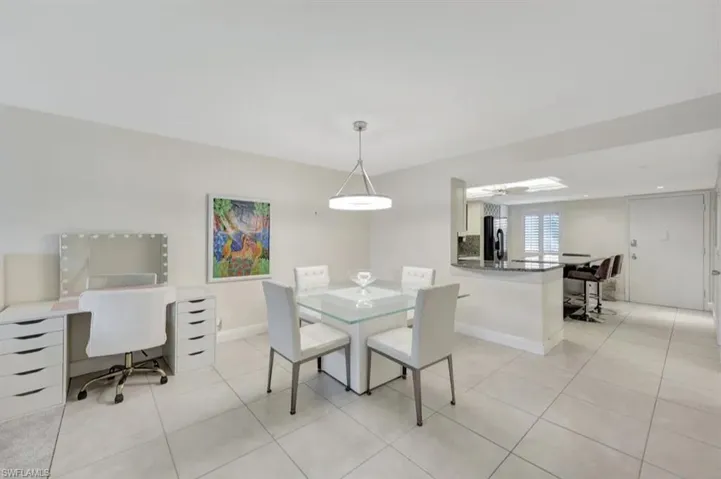 Dining room featuring light tile patterned floors
