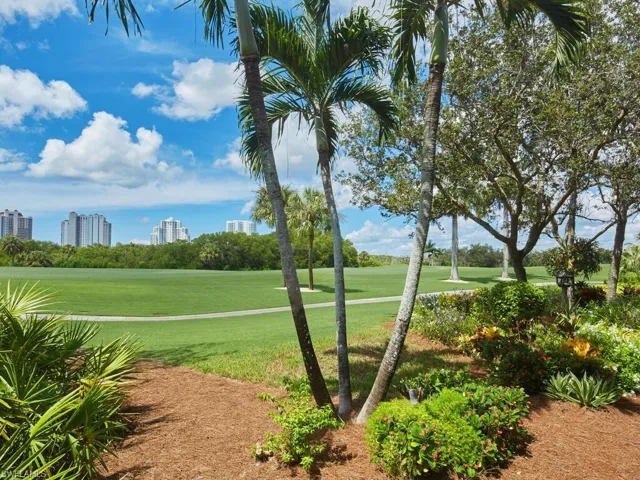 View of property's community with a lawn