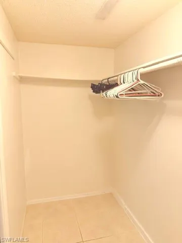 Master bedroom walk in closet left side view.