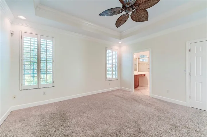 Primary bedroom with plantation shutters