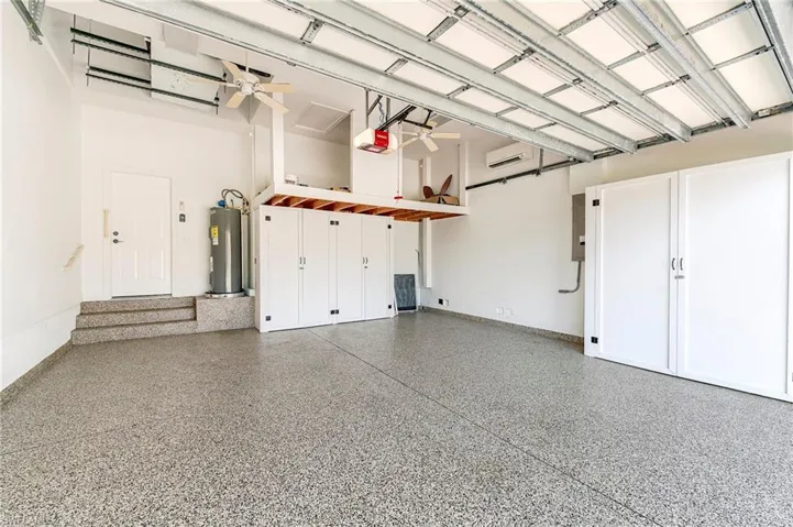 Air conditioned garage with storage cabinets