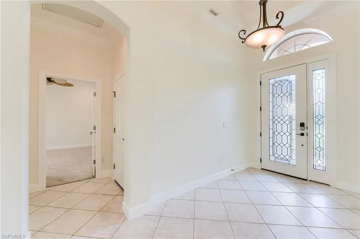 Entry foyer and hall to bedroom 3 on left
