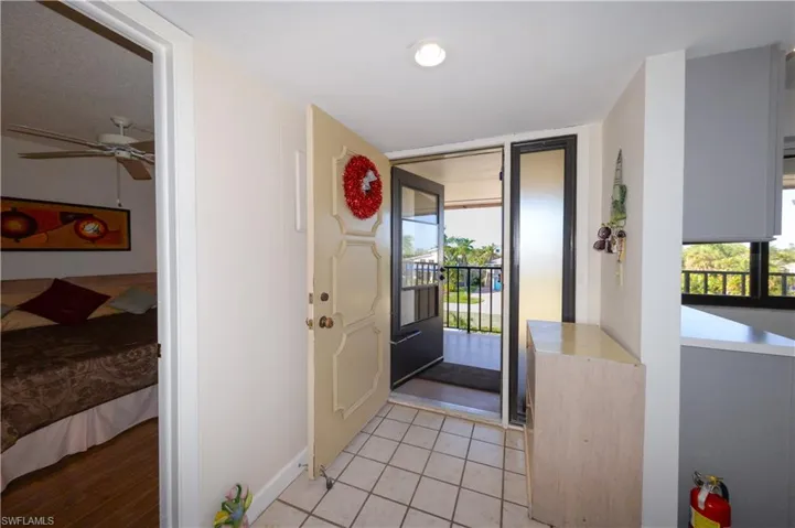 Foyer entrance with light tile patterned floors