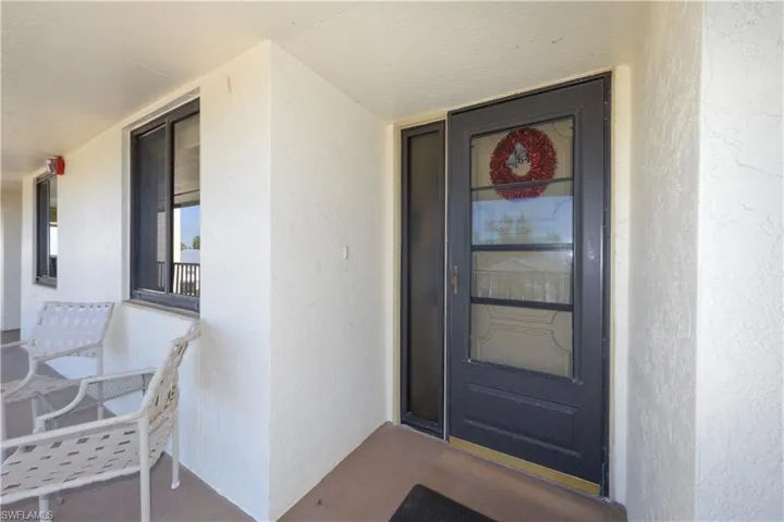 Property entrance with stucco siding