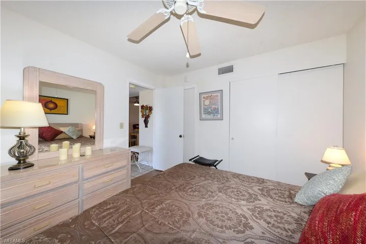 Bedroom featuring a ceiling fan and a closet