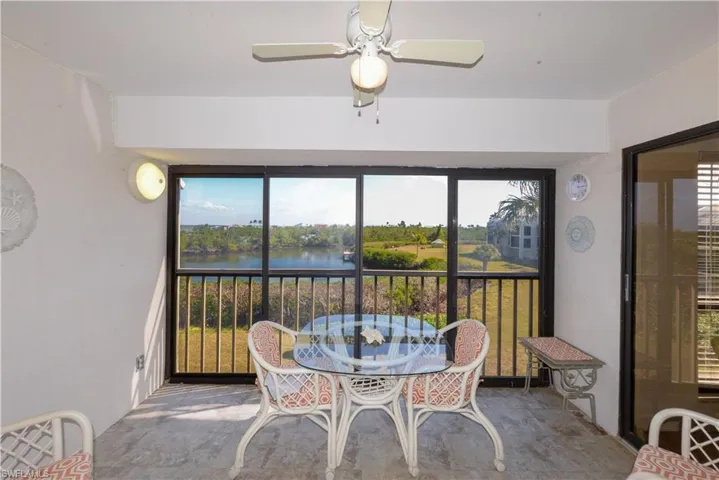 Sunroom / solarium featuring a water view and plenty of natural light