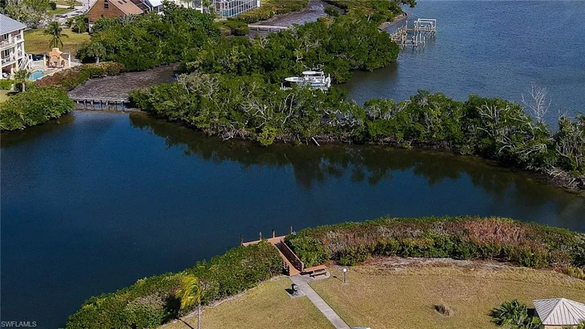 Aerial view of property's location featuring a large body of water