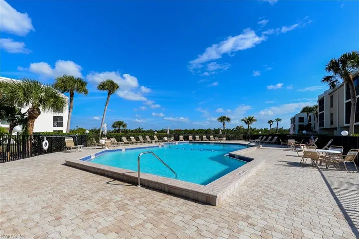 Community pool with a patio