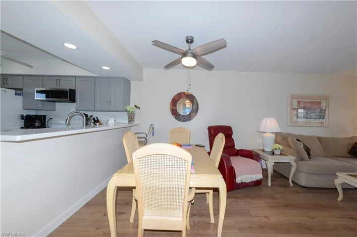 Dining room with ceiling fan and recessed lighting
