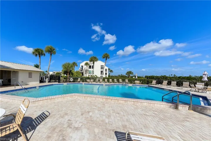 Community pool with a patio area
