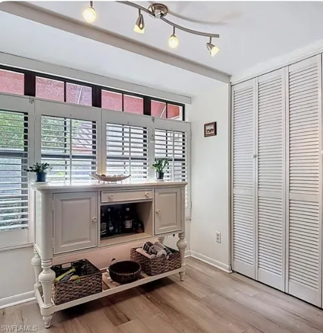 Detailed view of wood finished floors and baseboards