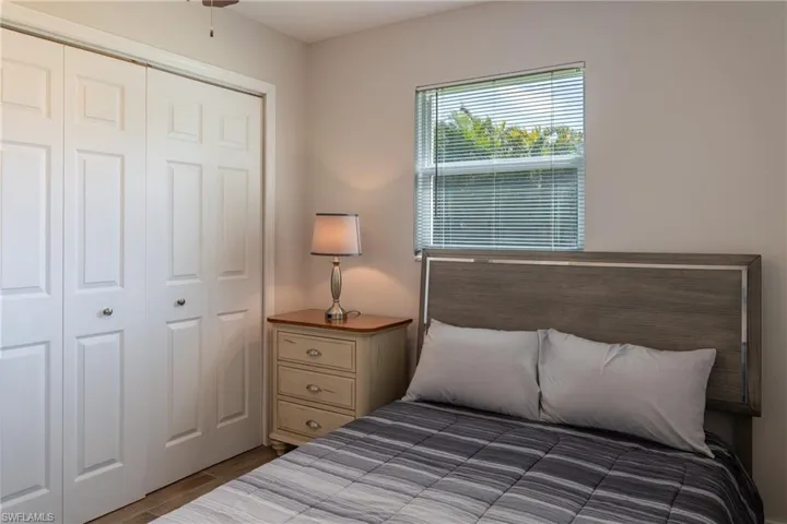 Bedroom with a closet and wood finished floors