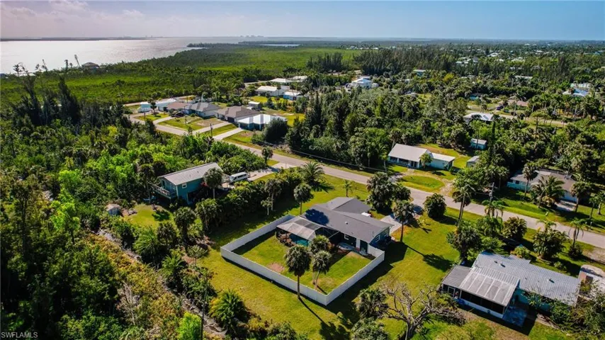 Drone / aerial view featuring a water view and a residential view