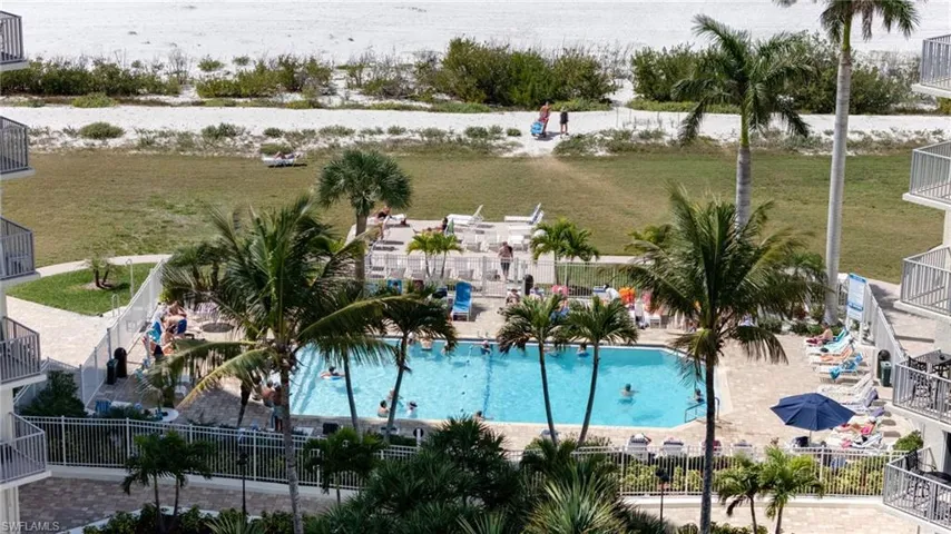 Community pool featuring a balcony