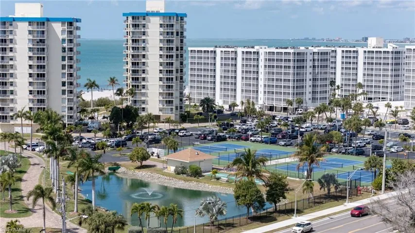 View of apartment building / complex with a water view