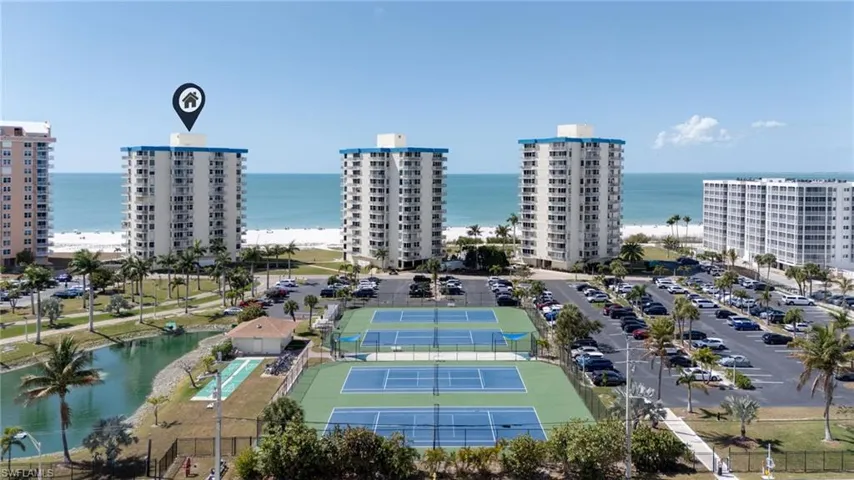 Bird's eye view of a large body of water and apartment complex