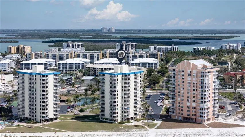 View of urban area with a large body of water and apartment complex