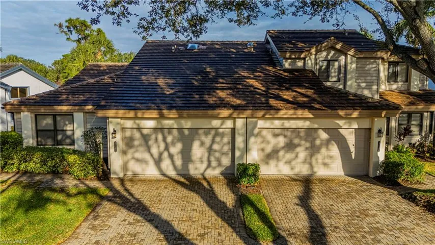 View of front facade featuring a garage
