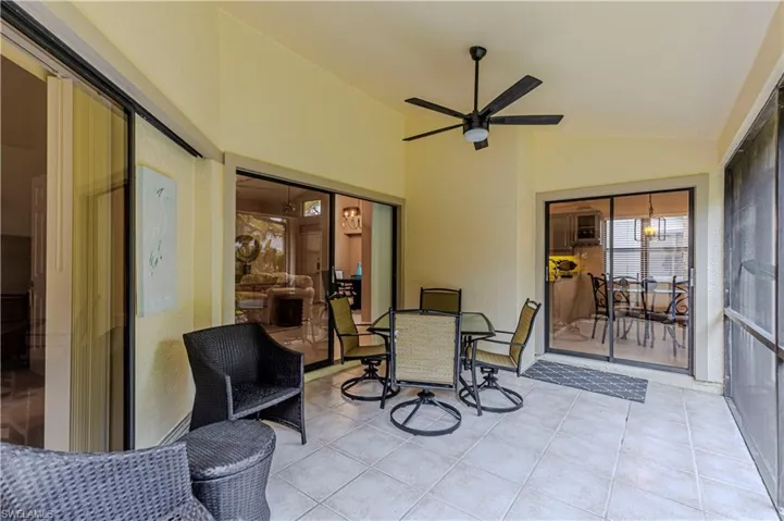 Screened in patio with vaulted ceiling and ceiling fan