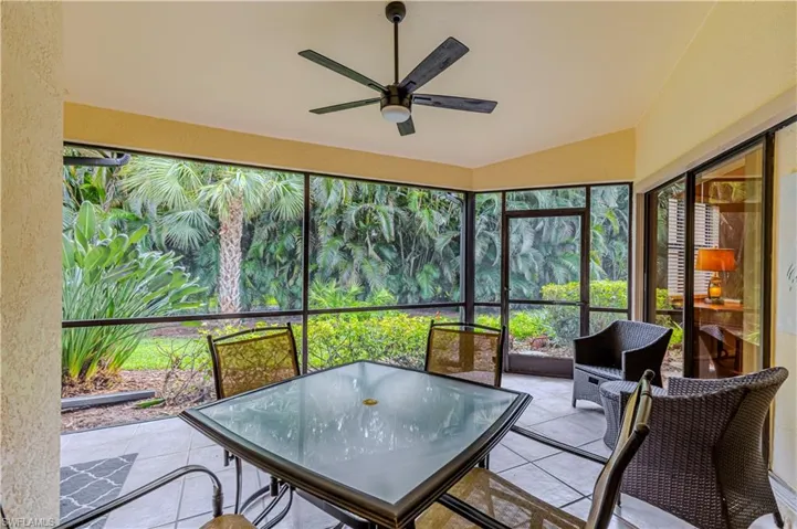Screened in patio with vaulted ceiling and ceiling fan