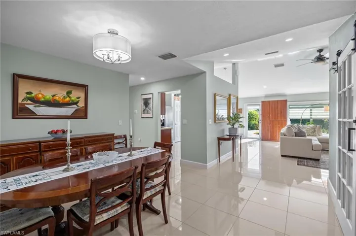 Dining space featuring light tile patterned floors, recessed lighting, and ceiling fan