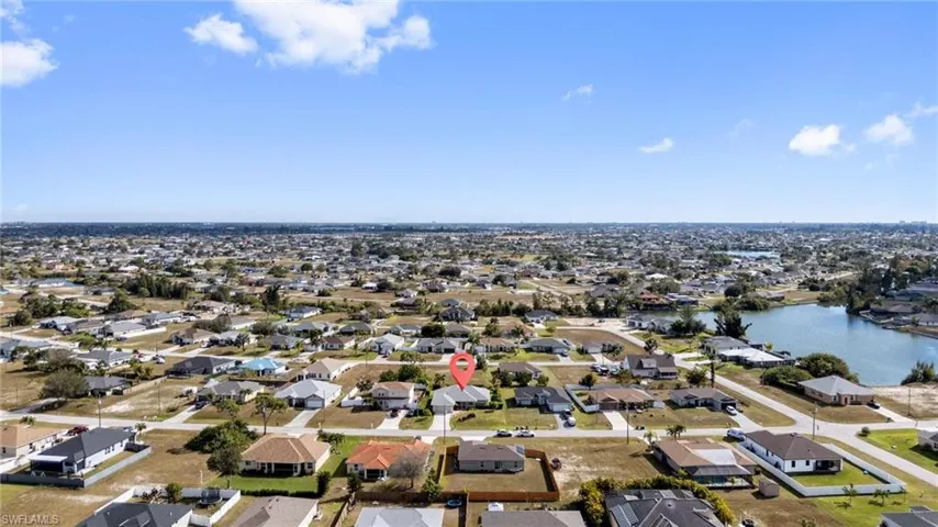 Aerial view of residential area with a nearby body of water
