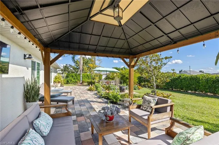 View of patio / terrace featuring an outdoor hangout area and a gazebo