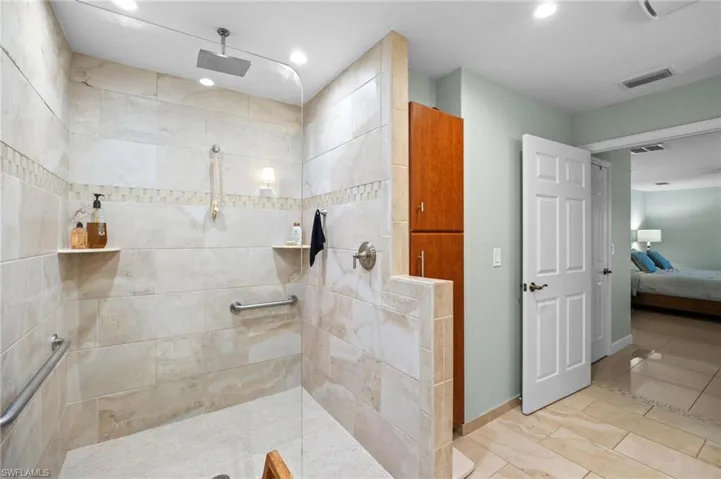Bathroom featuring ensuite bath, walk in shower, and recessed lighting