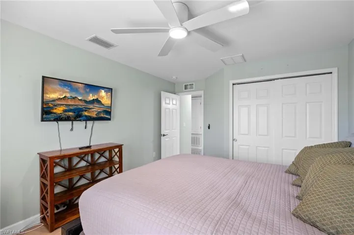 Bedroom featuring a closet and ceiling fan