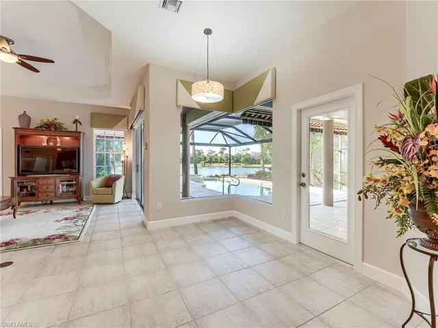 Entering family room.  Corner framleess window area