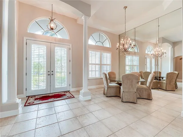 Entry French doors with formal dining ares