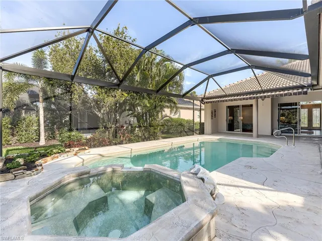 Poll and spa on a large artistic stamped concrete deck