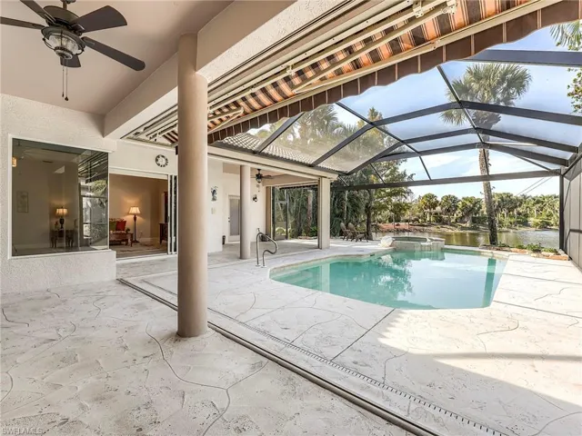 Covered lanai off primary and living room with retracting awning