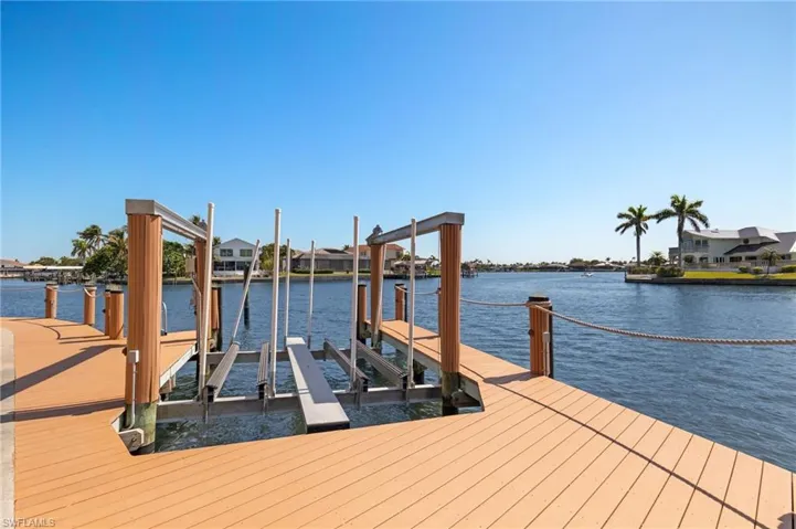 Dock area featuring a water view and boat lift