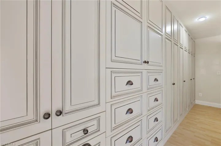 Interior details featuring wood finished floors and baseboards