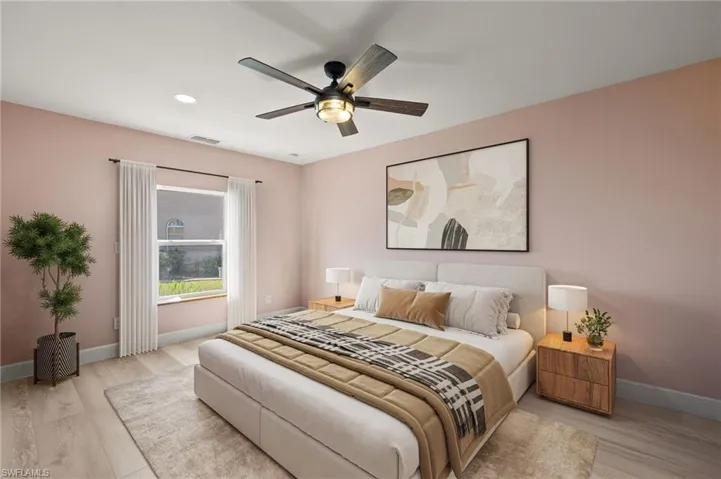 Bedroom featuring recessed lighting, light wood-style floors, visible vents, and baseboards