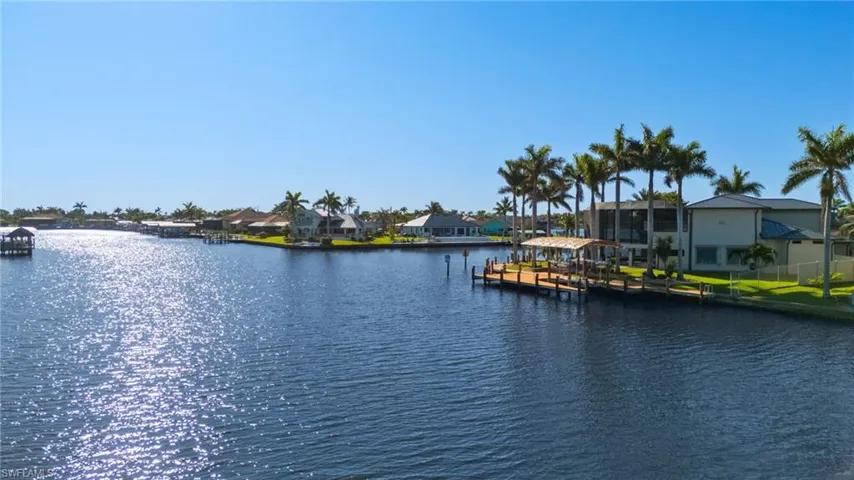 View of water feature with a boat dock and a residential view