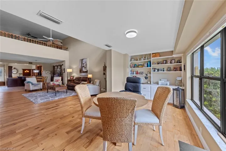 Dining room with light hardwood / wood-style flooring and ceiling fan
