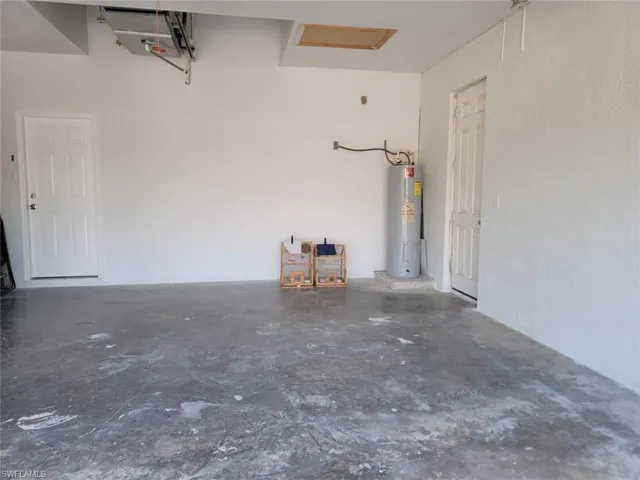 Garage featuring water heater