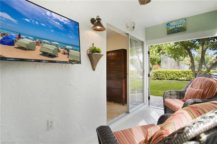 The Enclosed Lanai has hurricane impact double doors that open to the additional outdoor area.
