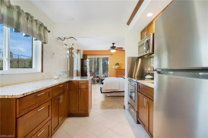 The kitchen features a custom designed unit that provides more surface area, storage and seating!